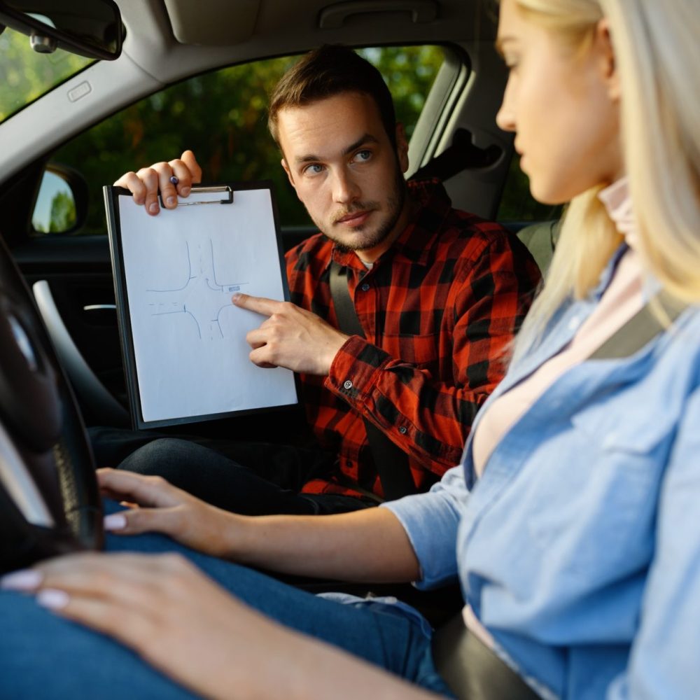woman-and-man-with-checklist-driving-school-1-e1627375367962.jpg